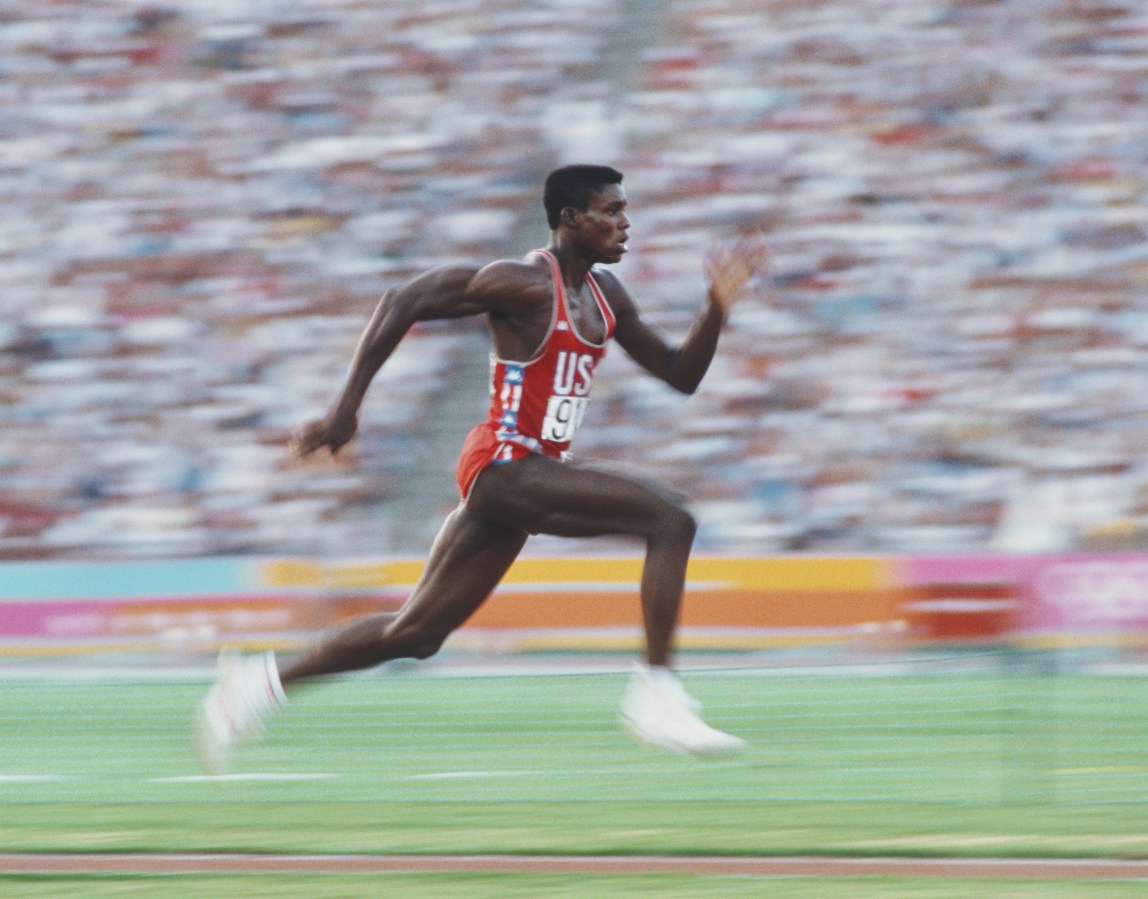 American athlete Carl Lewis accelerates down the runway as he competes in the Men's Long Jump event at the XXIII Olympic Summer Games at the Los Angeles Memorial Coliseum, Los Angeles, California, August 6, 1984.
