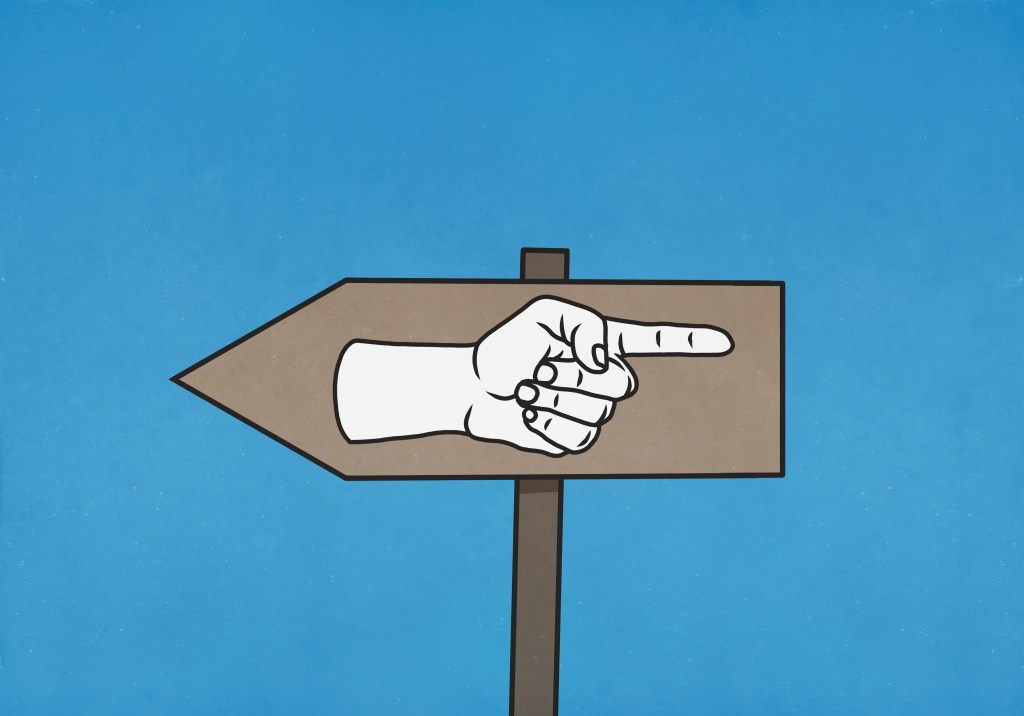 An arrow sign is pointing to the left. Inside it, a hand is pointing to the right to indicate uncertainty.