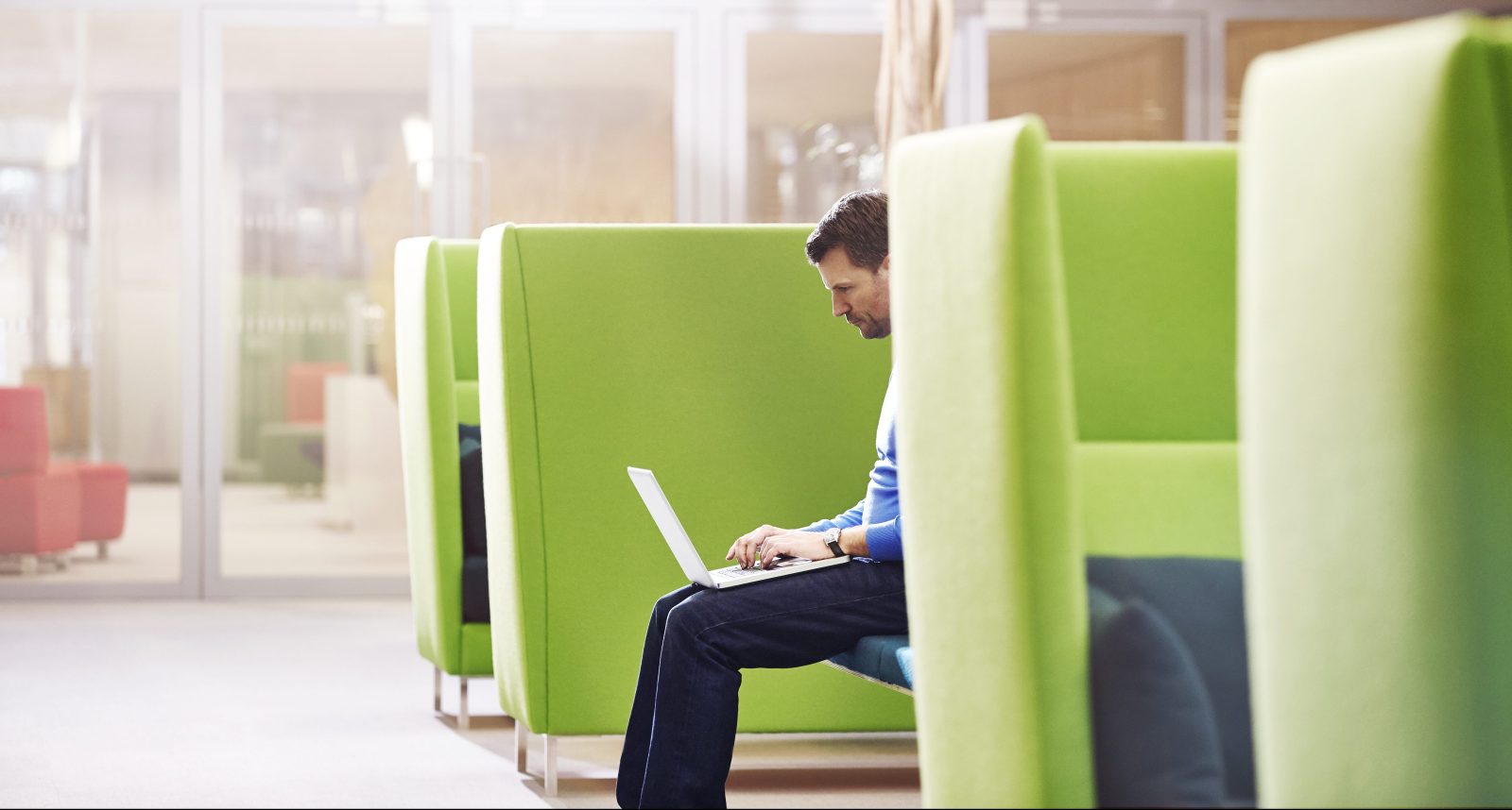 Businessman working on his laptop in modern office