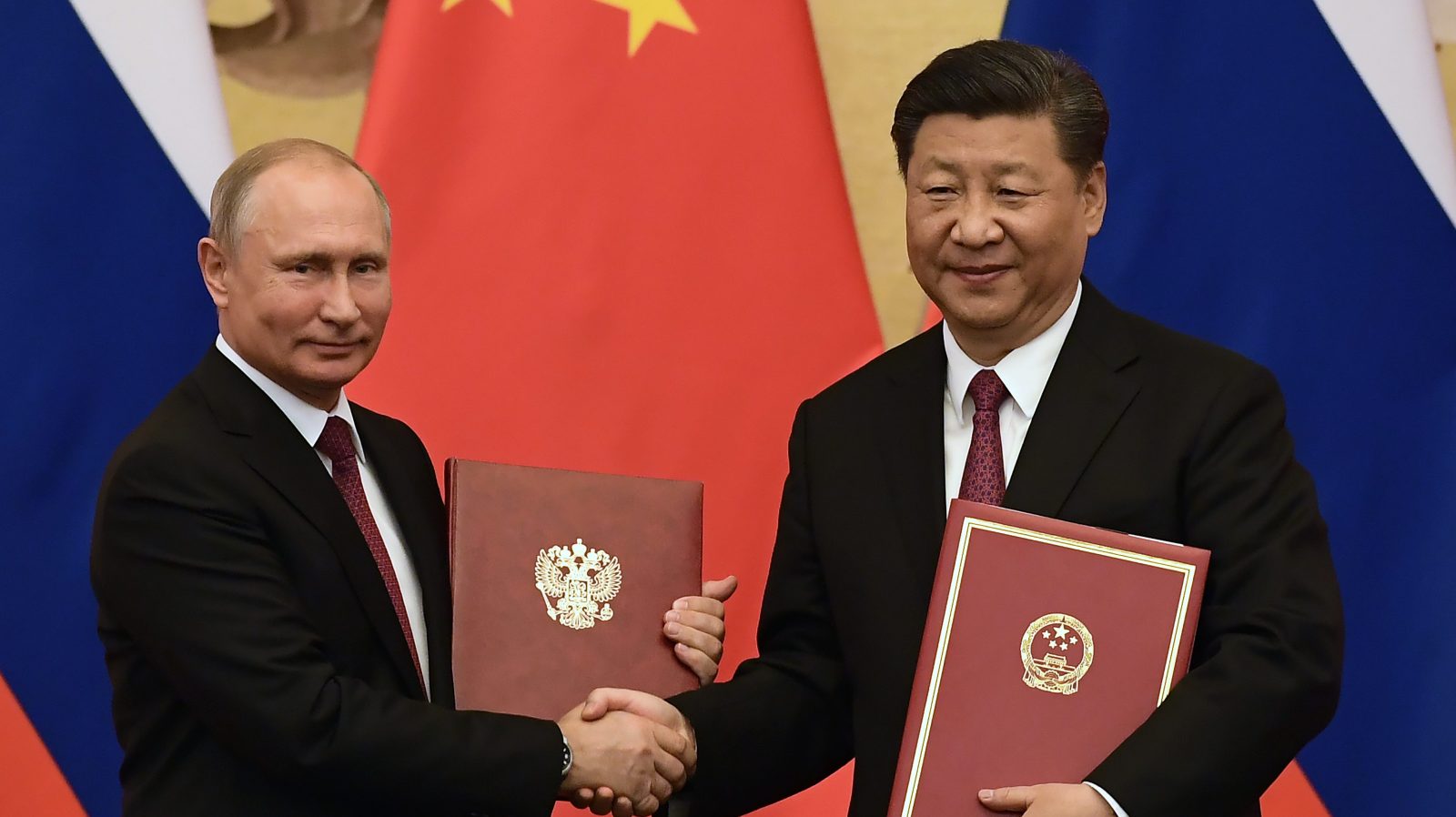 Russian President Vladimir Putin Receives Friendship Medal In Beijing
