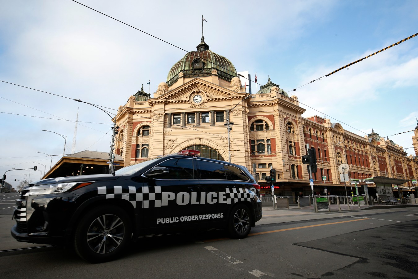 Police vehicle outside Flinders Street Railway Station in Melbourne
