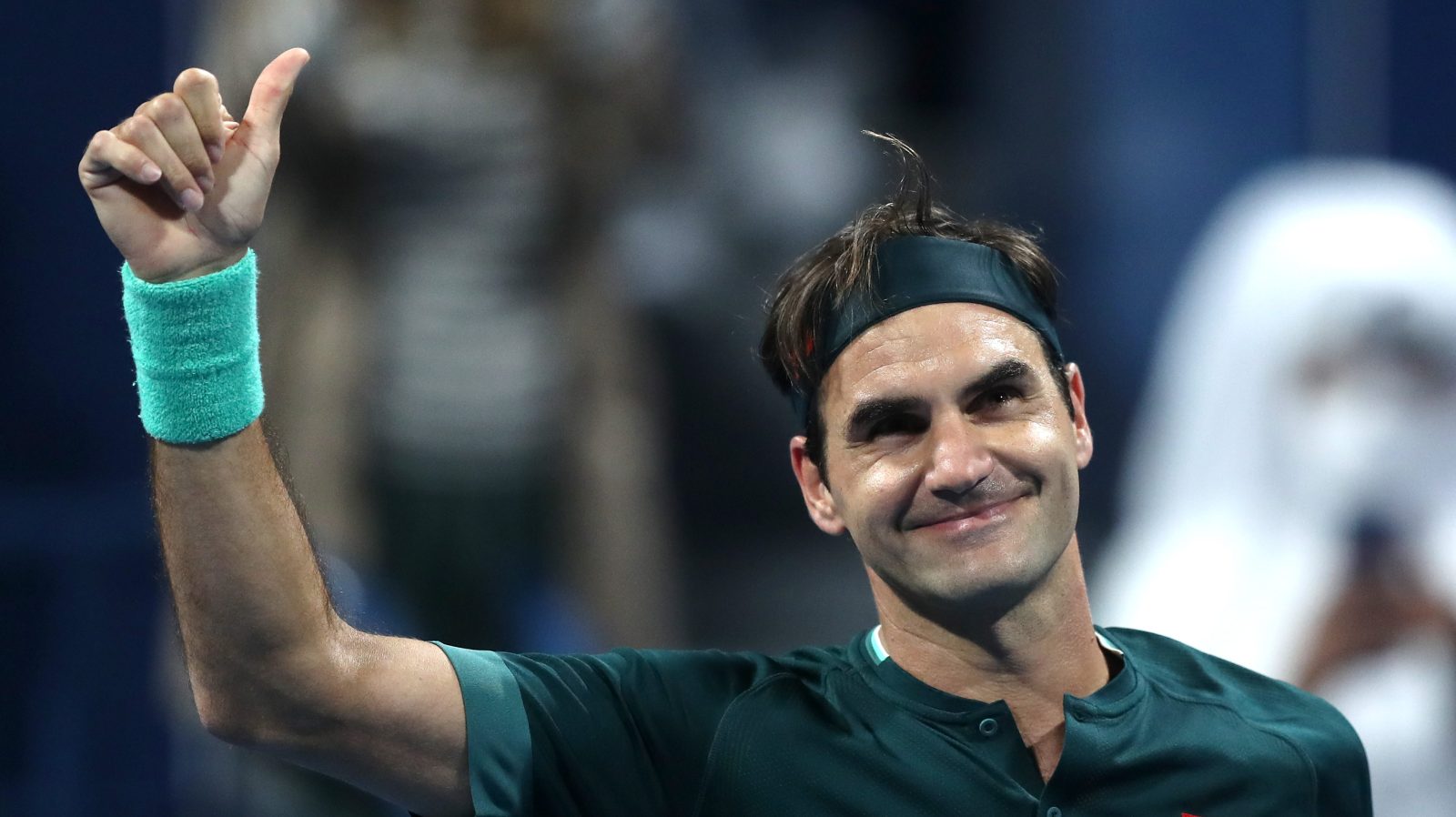 Roger Federer of Switzerland celebrates winning his match against Dan Evans of Great Britain on Day 3 of the Qatar ExxonMobil Open in 2021