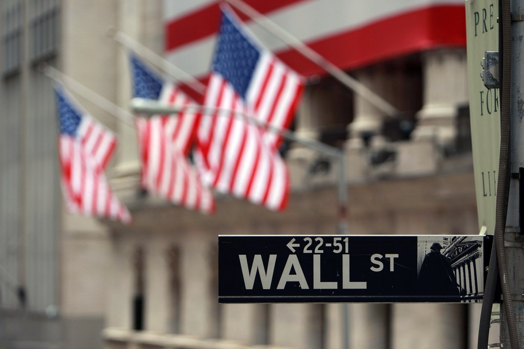 Wall Street sign and US flags