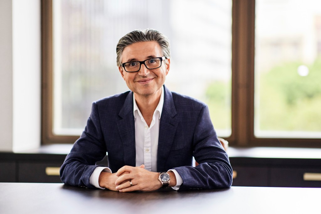 Alex Vynokur CEO and co-founder of BetaShares sitting at a desk.