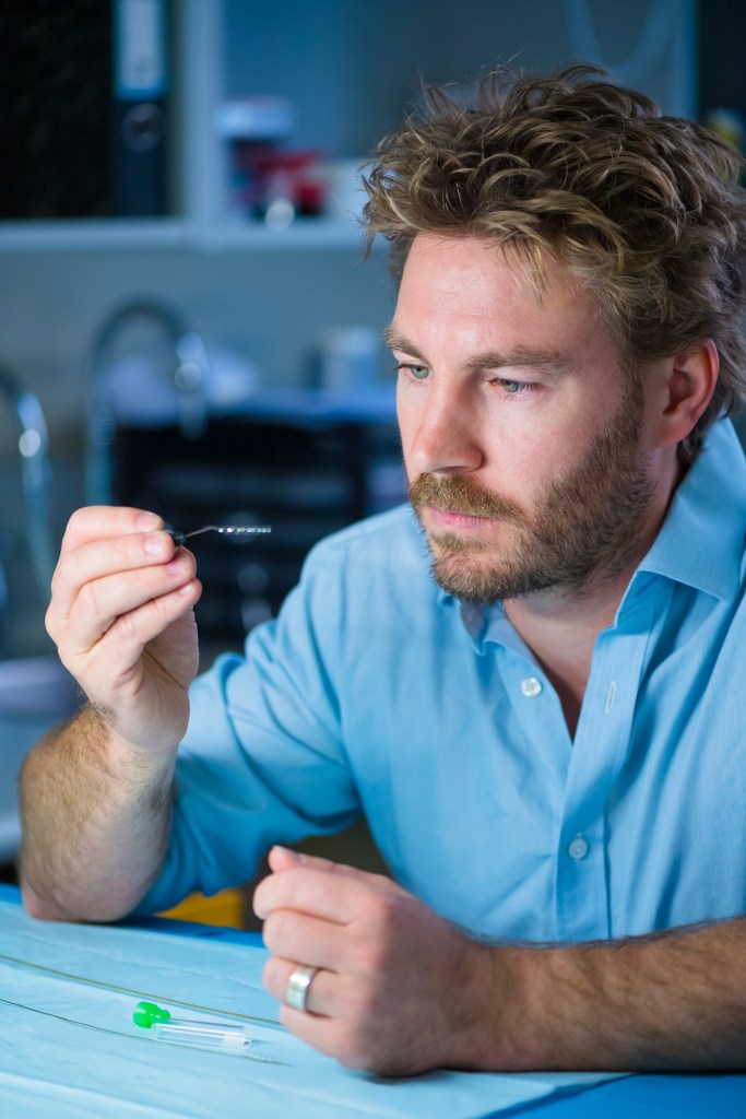Professor and Synchron co-founder, Nick Opie, holding the Stentrode. | Image source Supplied