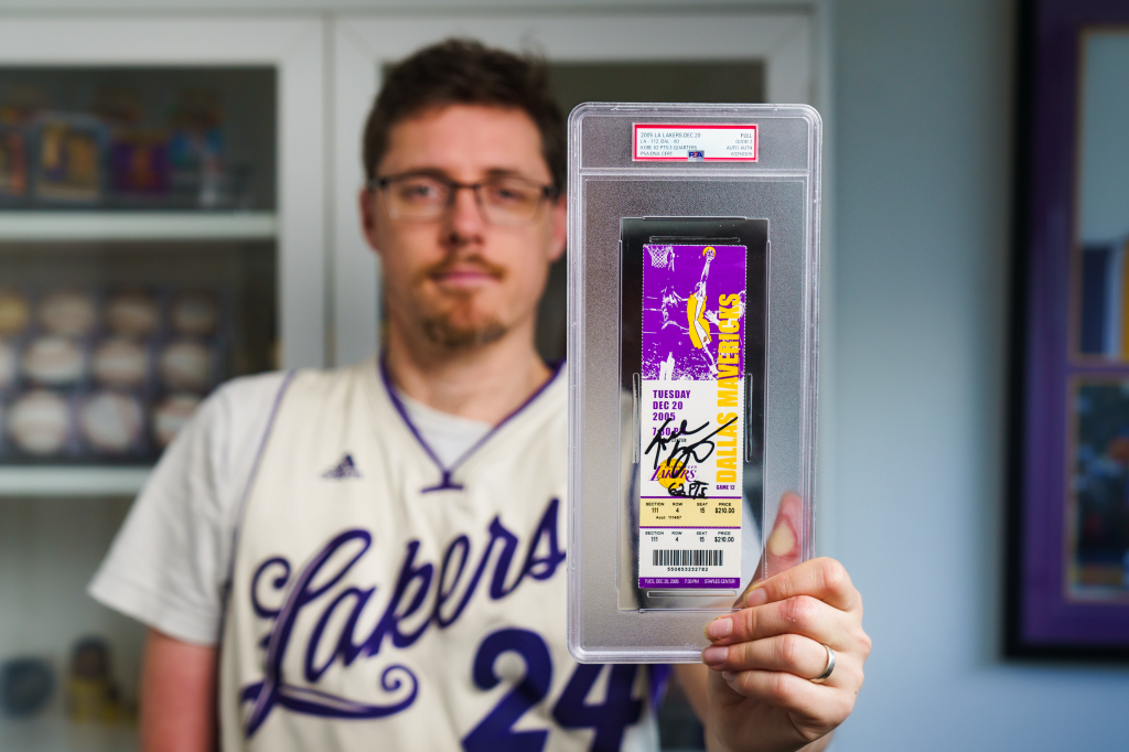 Superfan Josh Nicholls holding a prized signed Kobe Bryant ticket stub, worth an estimated $30,000-$40,000 | Image: supplied 
