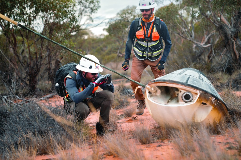 Space engineers inspect Varda W-2 capsule after it re-entered Earth in South Australia carrying a precious cargo of protein crystals for the antiviral drug Ritonavir, perfectly formed after 60 days in space . Manufacturing in space will be one of many hot topics at the 76th International Astronautical Congress in Sydney. Photo: Wiliam Godwin.