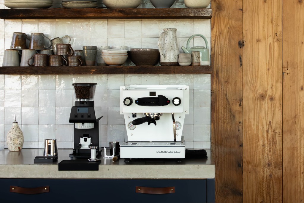 The La Marzocco Linea Mini, priced at $8,499, has become a status symbol for coffee lovers.