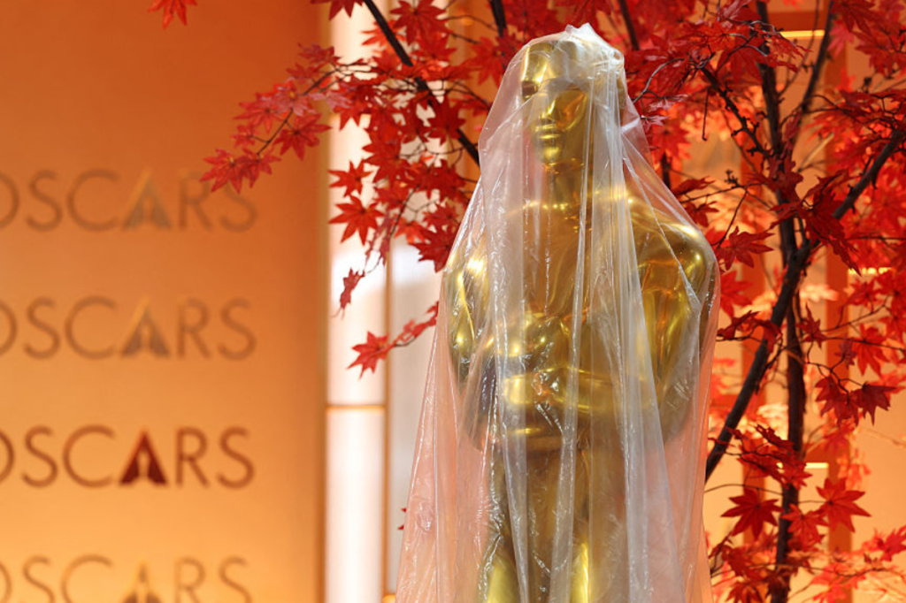 A decorative replica Oscar statue covered in protective plastic sheeting is seen as preparations are made on the red carpet arrivals area ahead of the 98th Annual Academy Awards in Hollywood, California, on March 13, 2026. (Photo by ANGELA WEISS / AFP via Getty Images)