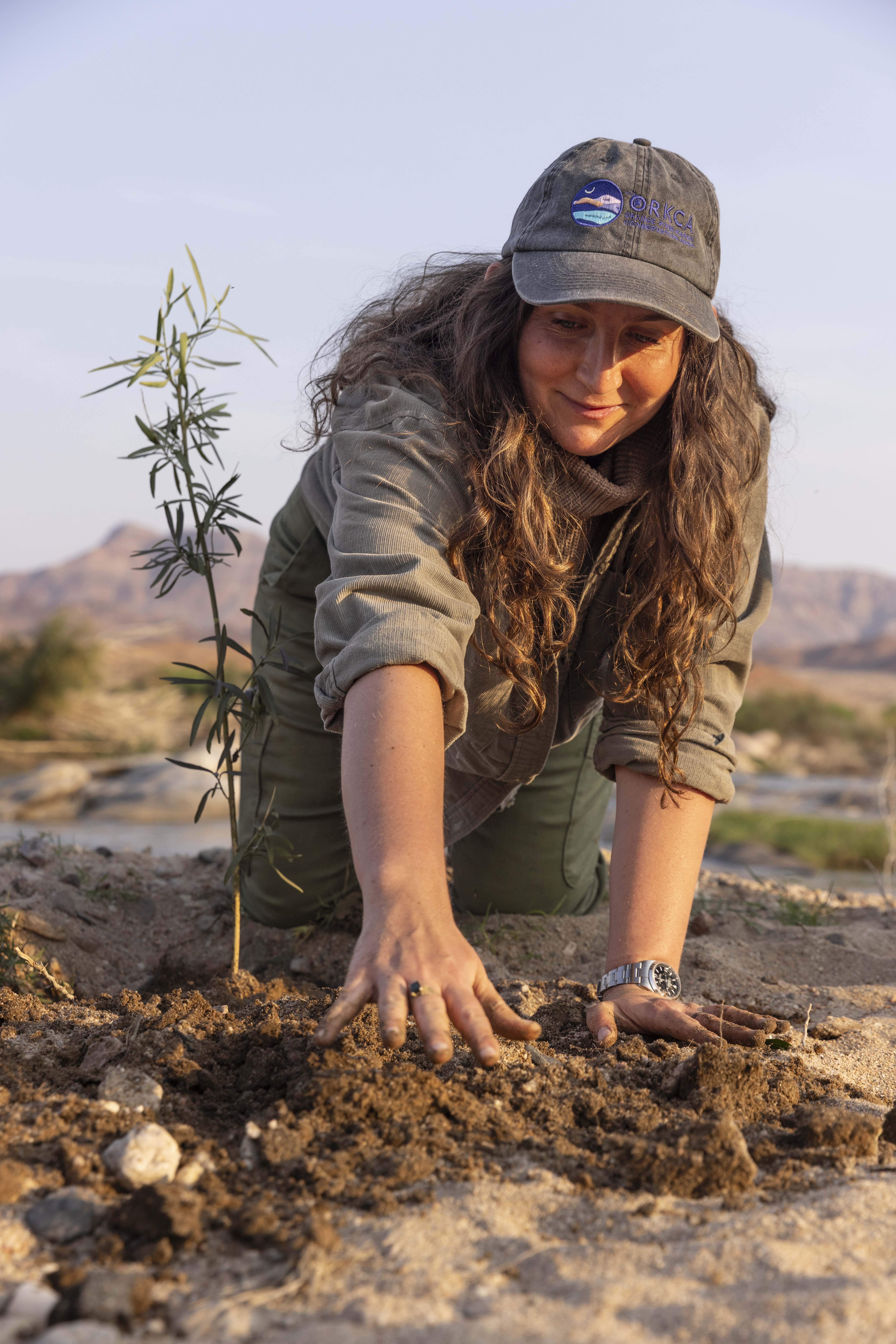 Andreia Pawel planting trees on the Orange River