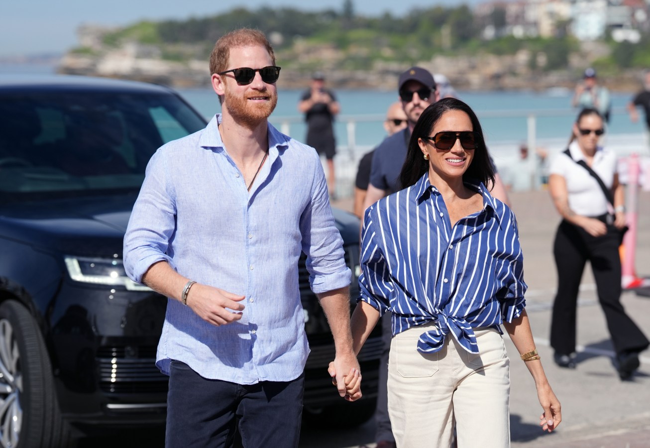 Prince Harry, Duke of Sussex and Meghan, Duchess of Sussex arrive to meet volunteer first responders from Bondi Surf Bathers' Life Saving Club. Image: Getty